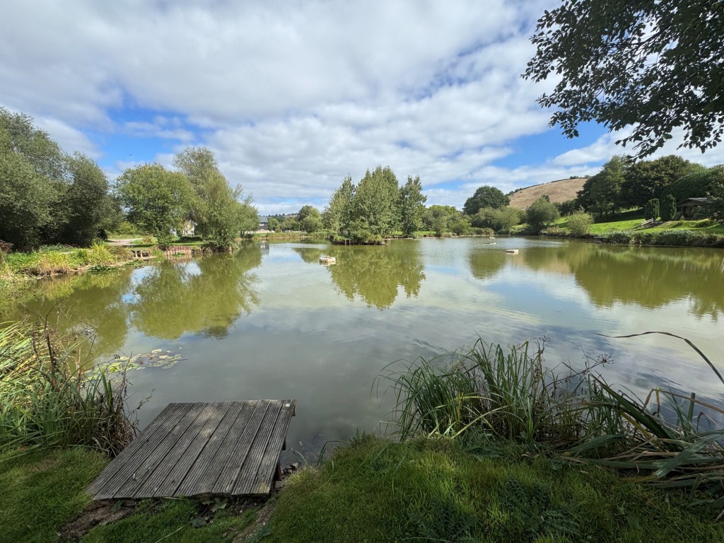 Lot: 71 - FREEHOLD TEN ACRE SITE WITH LAKES AND LODGES - Main Lake - view 2 with swim